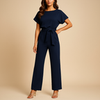 side view of sleeveless jumpsuit with high waist design and lace up front detail for women